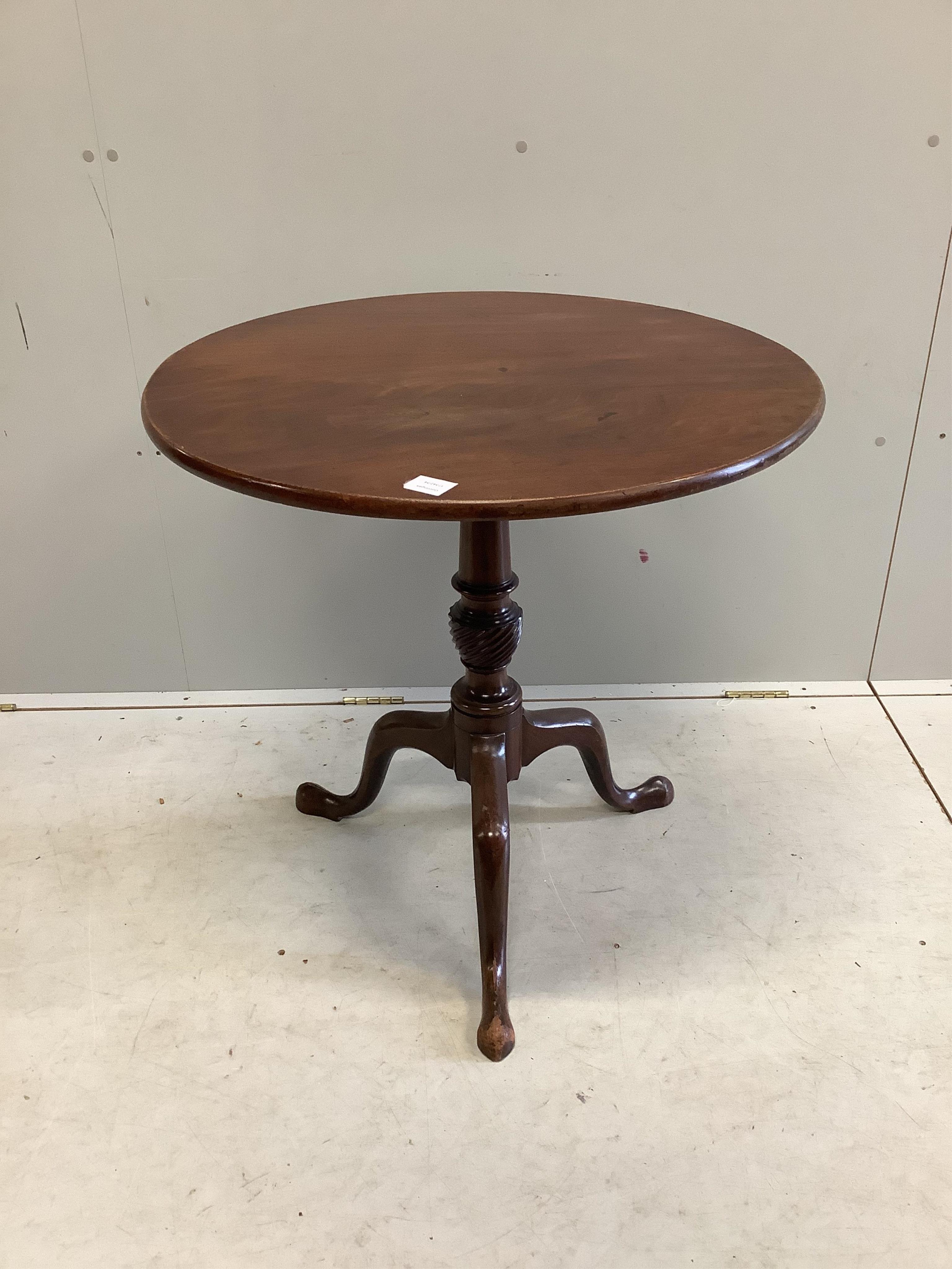 A George III mahogany circular tilt top tripod tea table, diameter 73cm, height 72cm. Condition - fair